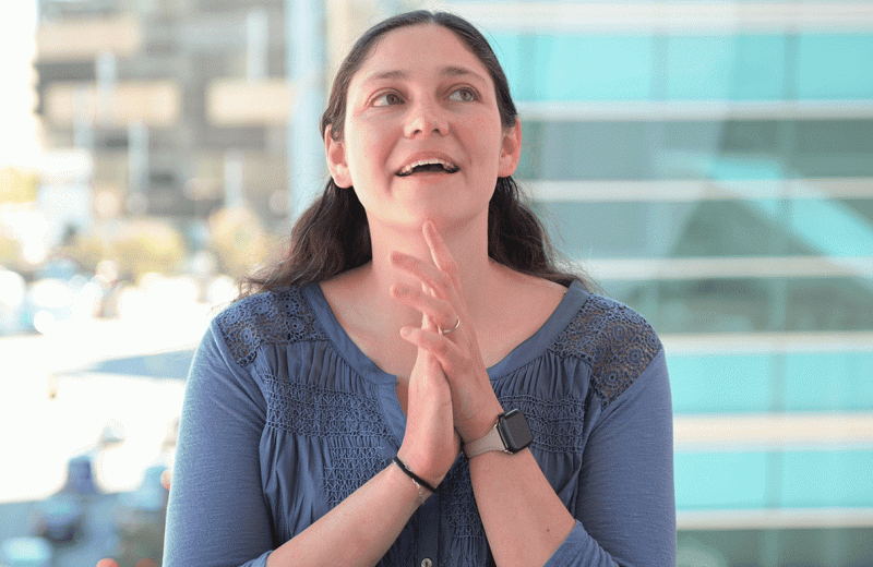 GIF of Sarah Nyquist speaking during a seated interview at Gladstone