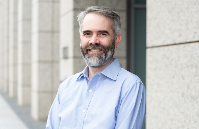 Headshot of Alex Pico outside the Gladstone building